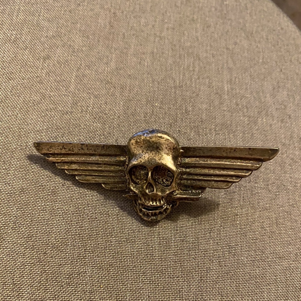 Vintage brass pin, skull and wings